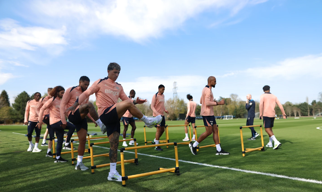 Chelsea team doing stretches at training ground