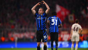 Inter Milan player Davide Frattesi celebrating in stadium at night
