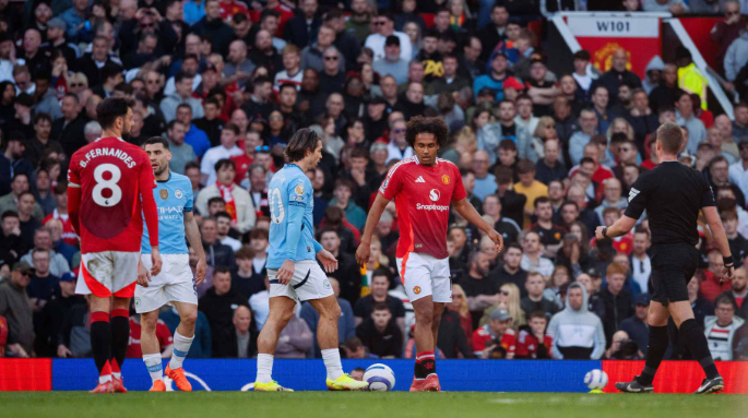 Manchester United and Manchester City platers at Old Trafford pitch during derby