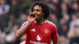 Manchester United player Joshua Zirkzee calling out to a teammate during a football match