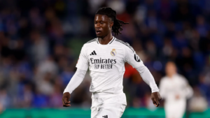 Real Madrid midfielder Eduardo Camavinga walking on a pitch