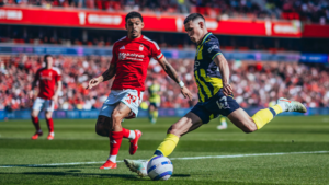 Manchester City player Phil Foden faces Morgan Gibbs-White for Nottingham Forest at the City Ground in March