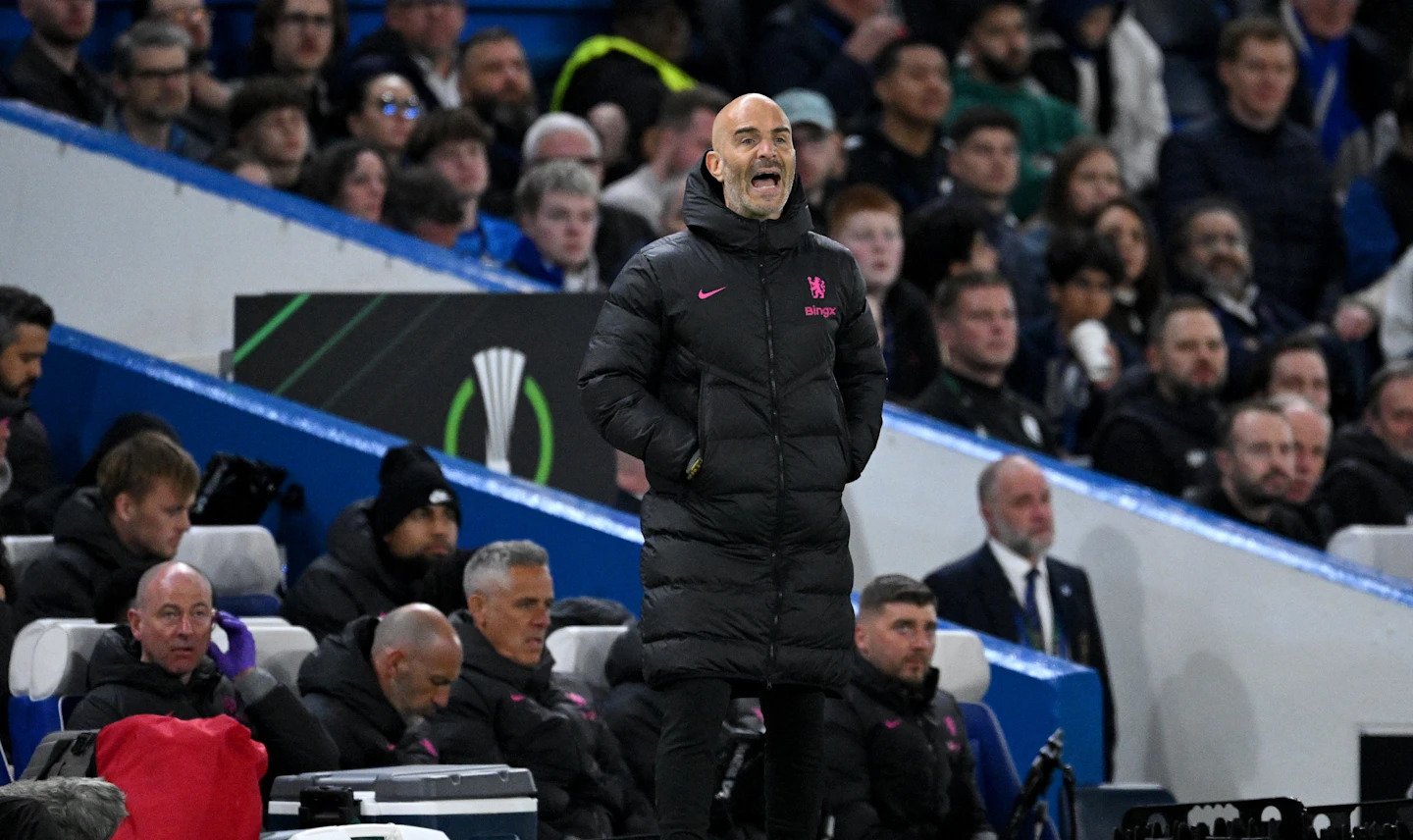 Chelsea coach Enzo Maresca standing during a game