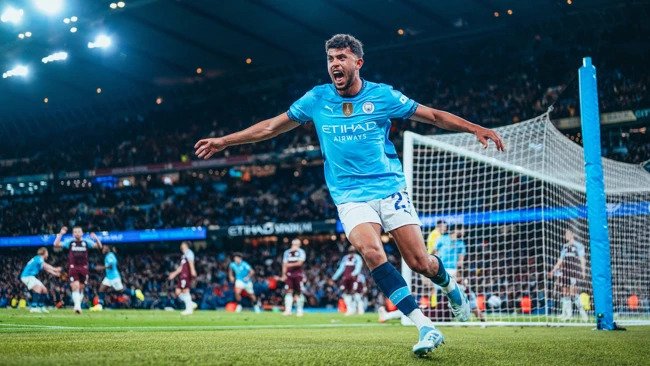 Manchester City player Matheus Nunes celebrating his late winner against Aston Villa