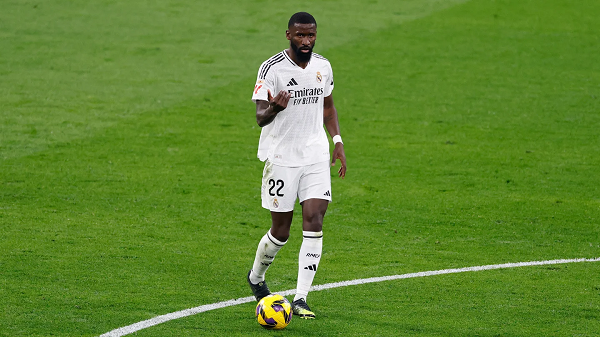 Real Madrid defender Antonio Rudiger with the ball on a pitch