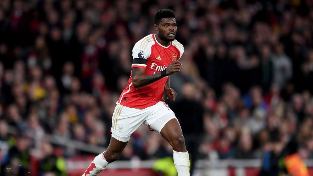 Arsenal midfielder Thomas Partey running on a football pitch