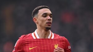 Liverpool defender Alexander-Arnold jogging during a match at Anfield
