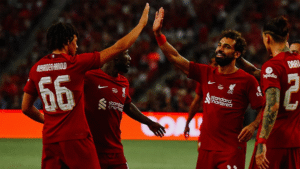 Liverpool players Mohamed Salah and Trent Alexander-Arnold celebrating a goal