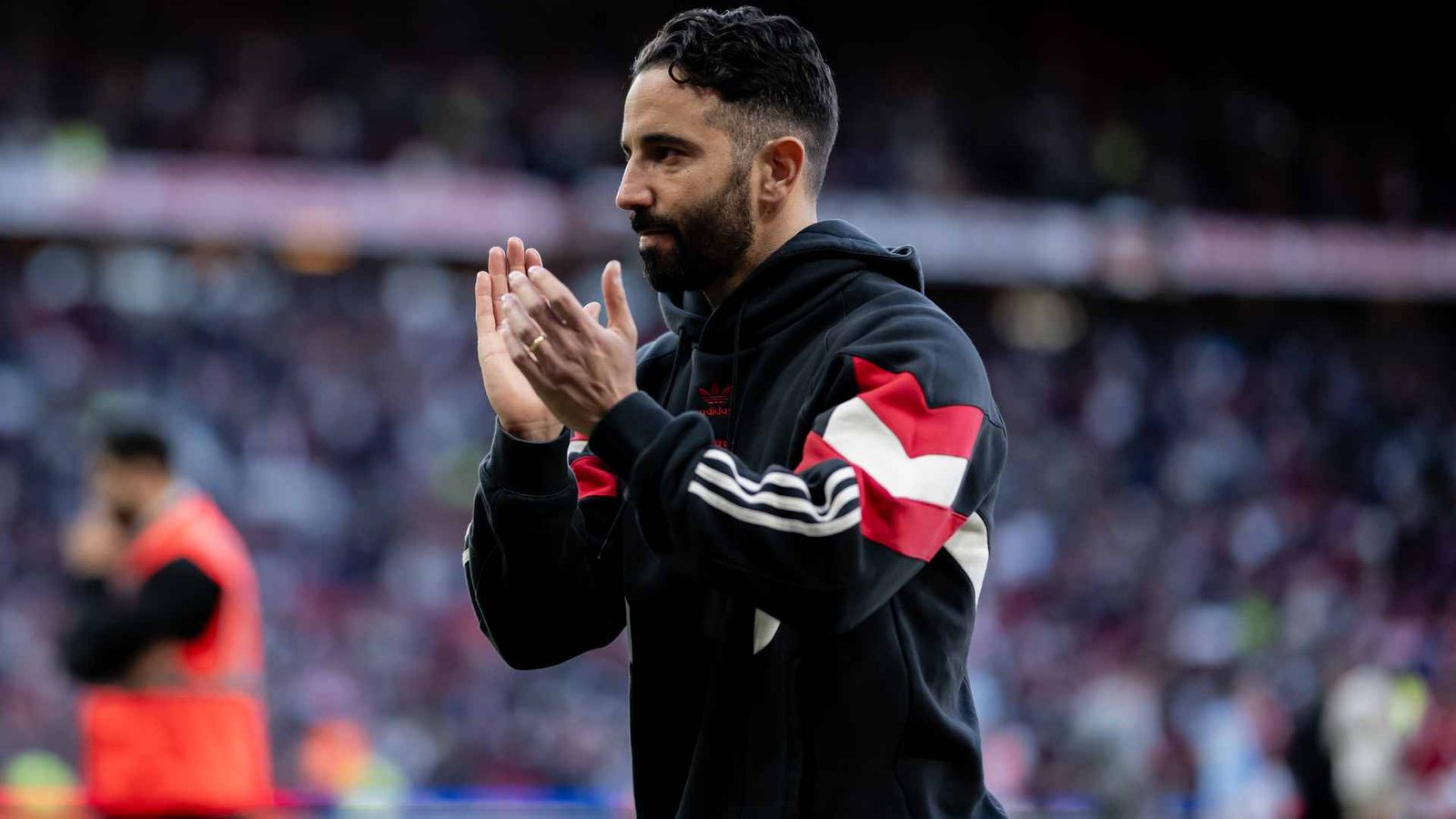 Manchester United coach Ruben Amorim clapping the fans after a match