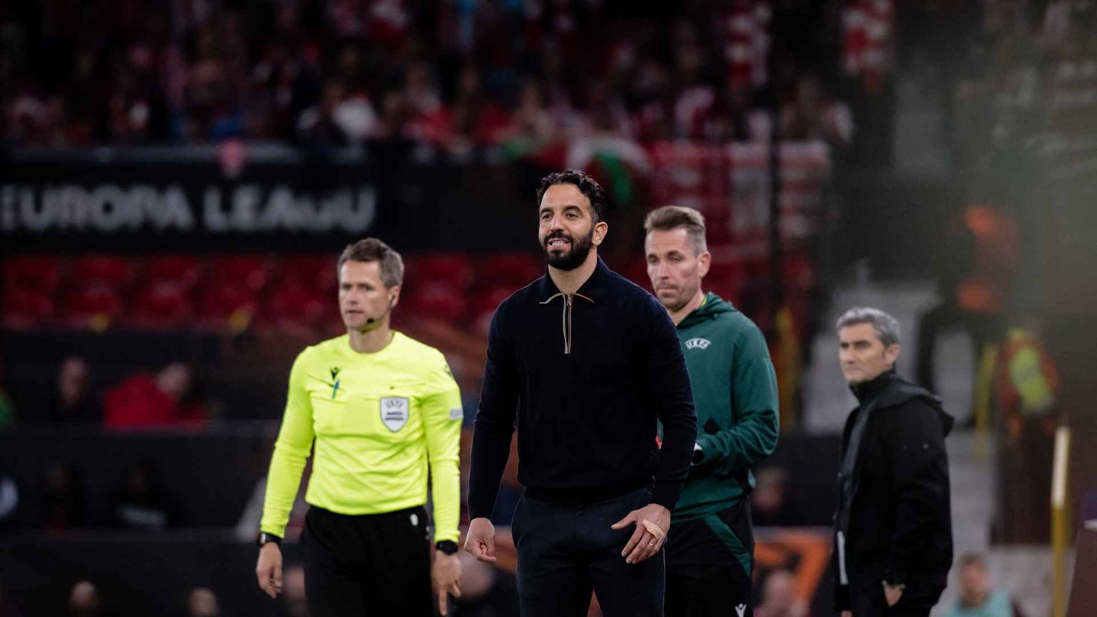 Manchester United head coach Ruben Amorim walking on the pitch after a match