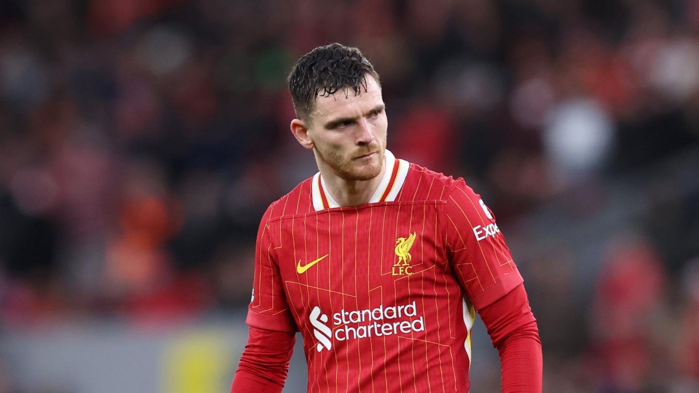 Liverpool left-back Andy Robertson walking during a Premier League game against Fulham