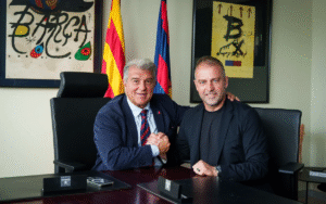 Barcelona coach Hansi Flick posing with club president Joan Laporta in office
