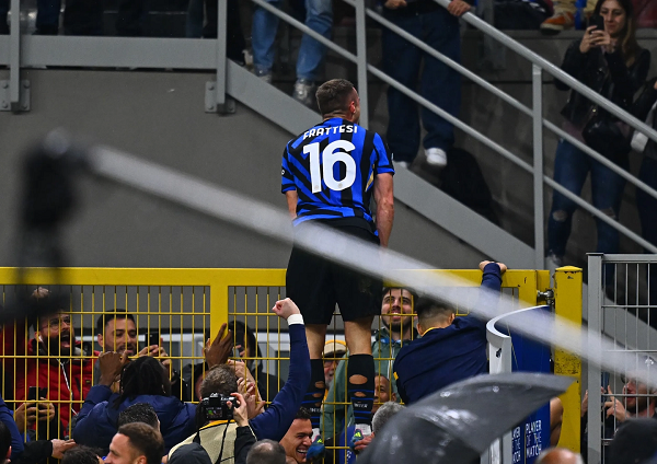 Davide Frattesi celebrating towards fans after scoring deep in extra time