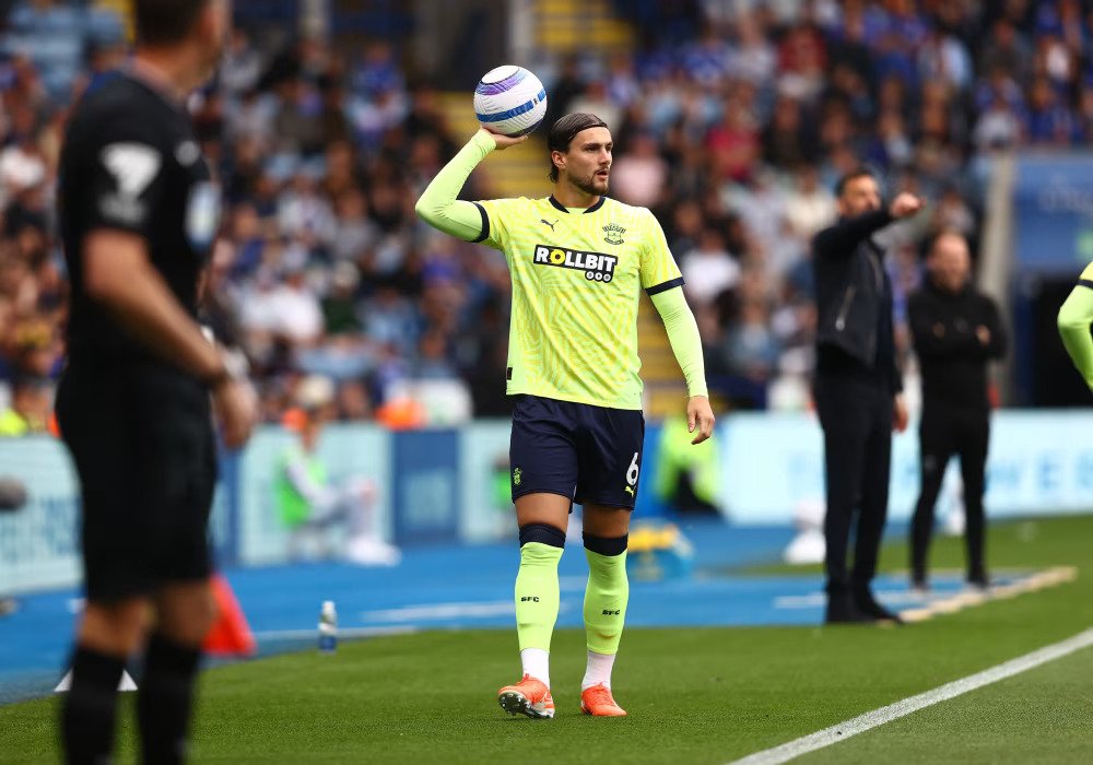 Southampton player Taylor Harwood-Bellis about to take a throw during a Premier League match