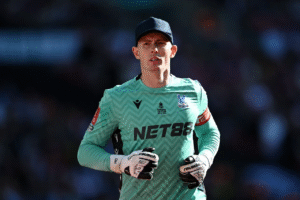 Crystal Palace goalkeeper Dean Henderson on the pitch after VAR decision allowed him to play on