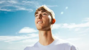 Bournemouth and now Real Madrid defender Dean Huijsen staring ahead with sky and clouds in the background