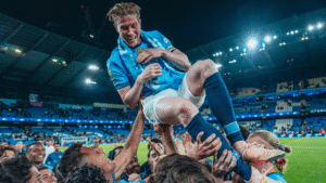 Manchester City players tossing Kevin De Bruyne in the air after last home game