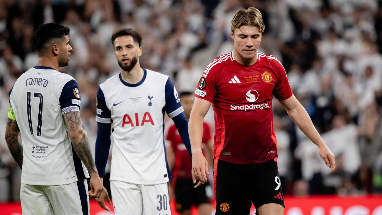 Manchester United striker Rasmus Hojlund walking dejectedly during match against Tottenham Hotspur at San Mames stadium in Bilbao, Spain