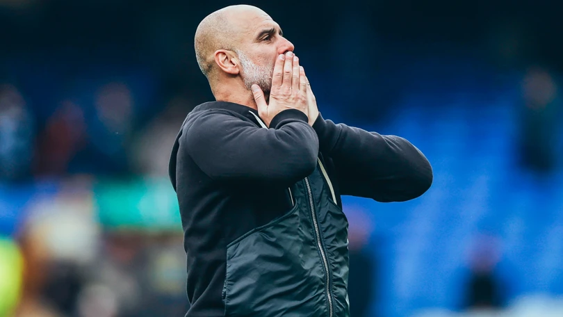 Manchester City manager Pep Guardiola reacting to a match on the sidelines