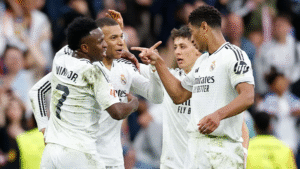 Real Madrid players celebrating after scoring a goal at the Santiago Bernabeu