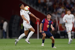 Real Madrid player Jude Bellingham controlling the ball during a match against Barcelona