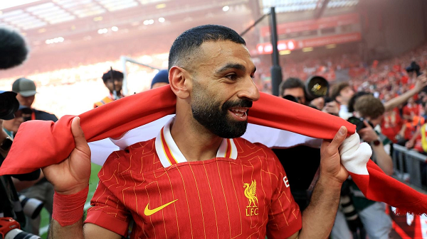 Liverpool winger Salah celebrating at Anfield after Premier League win