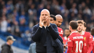 Arne Slot apllauding Liverpool fans at Anfield