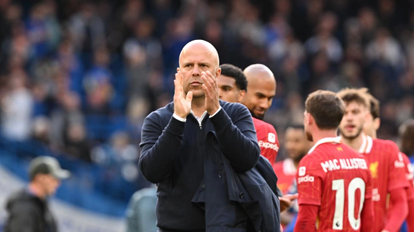 Liverpool manager Arne Slot applauding fans after a match