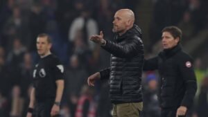 Erik ten Hag standing on the sidelines during a Manchester United match