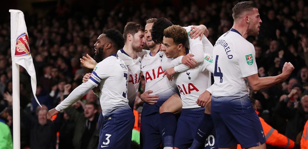 Tottenham players celebrating a goal against Arsenal in the Premier League