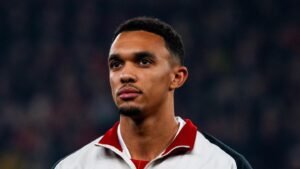 Liverpool defender Trent Alexander-Arnold standing before a match