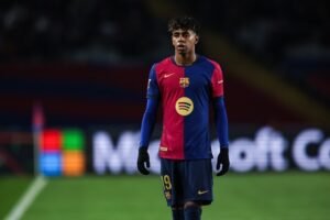 Barcelona winger Lamine Yamal walking during a football match