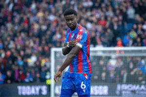Marc Guehi wearing the armband for Crystal Palace in a Premier League match