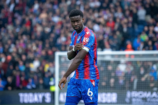 Marc Guehi wearing the armband for Crystal Palace in a Premier League match