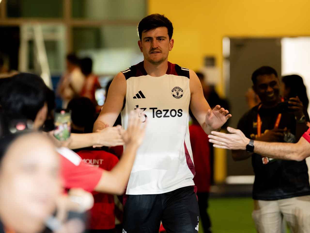 Manchester United defender Harry Maguire greeting fans in Kualar Lumpur.