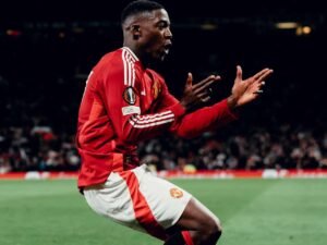 Kobbie Mainoo celebrating a goal in the Europa League for Manchester United.