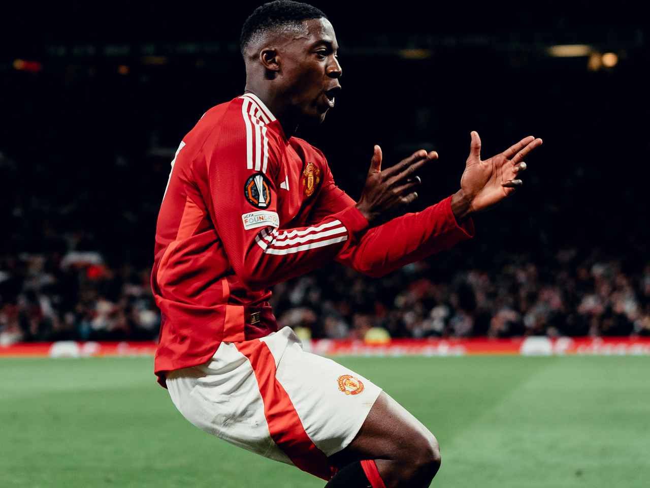 Kobbie Mainoo celebrating a goal in the Europa League for Manchester United.