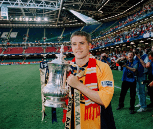 Michael Owen holding the FA cup at Wembley