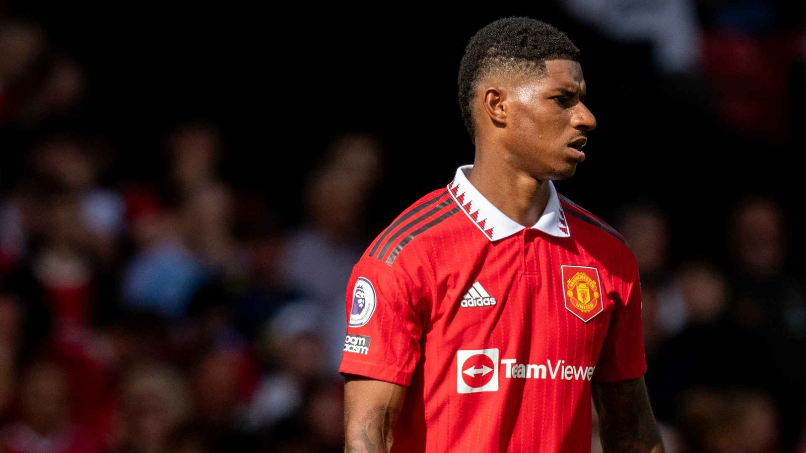Marcus Rashford in a Manchester United shirt during a football match at Old Trafford