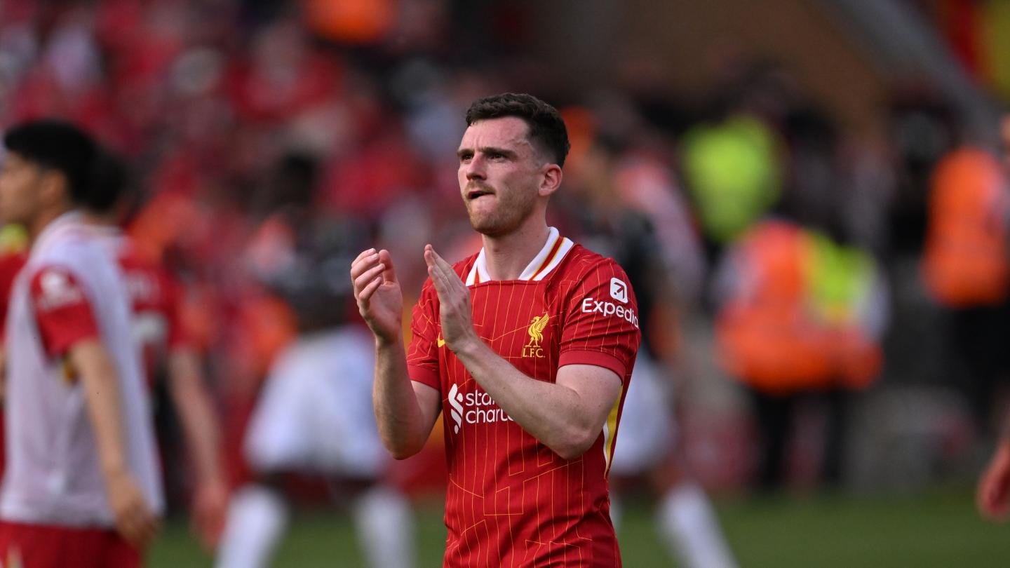 Liverpool left-back Andy Robertson applauding fans after a match at Anfield