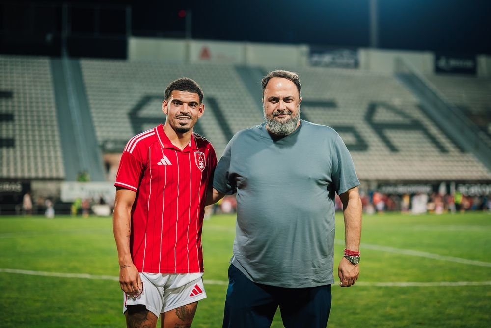 Evangelos Marinakis posing with Morgan Gibbs-White after the midfielder signed a new three-year contract with Nottingham Forest