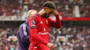 Manchester United forward Matheus Cunha walking off the pitch