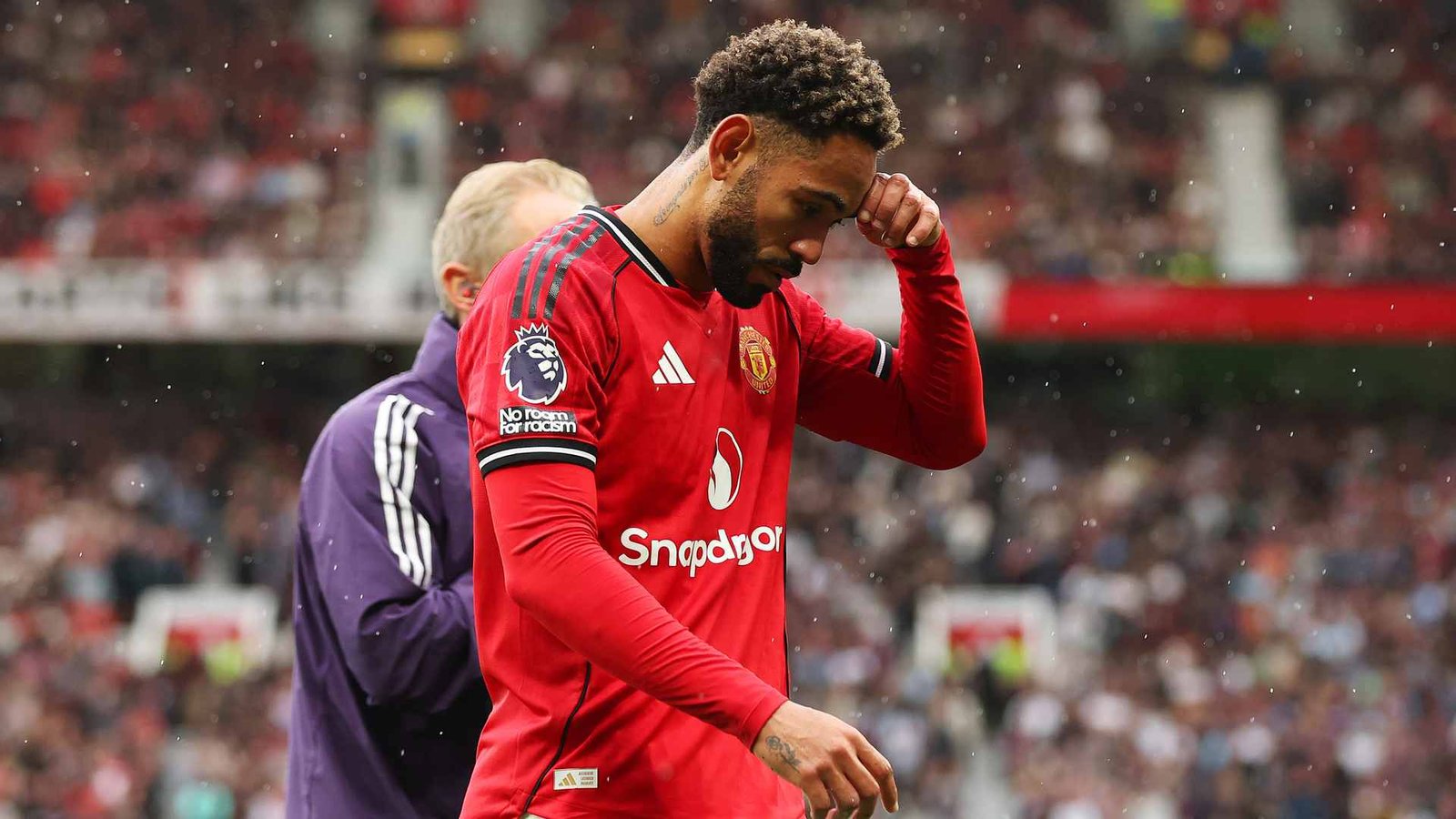Manchester United forward Matheus Cunha walking off the pitch