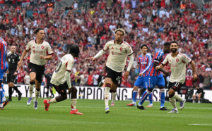 Hugo Ekitike (centre) wheeling off in celebration after scoring the opener against Crystal Palace.