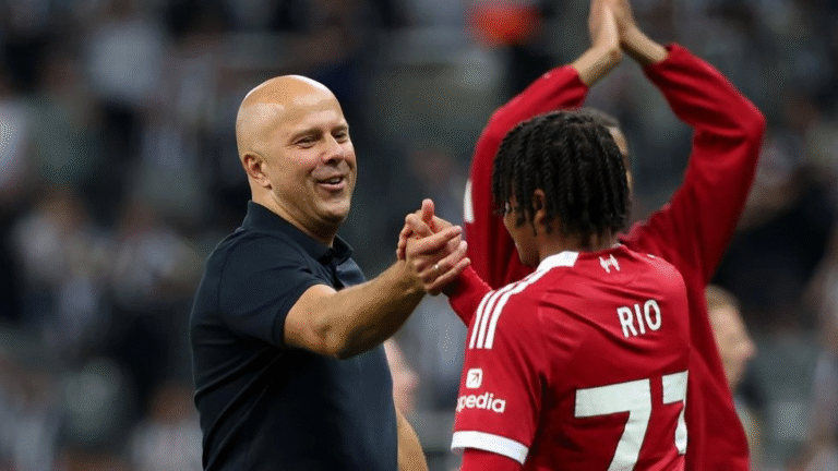 Rio Ngumoha shaking hands with Liverpool manager Arne Slot