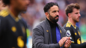 Manchester United head coach Ruben Amorim standing alongside his players after defeat to Brentford