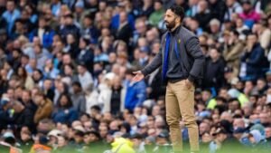 Manchester United head coach Ruben Amorim standing on the sidelines in his side's derby game against Manchester City
