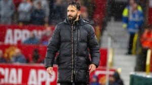 Manchester United head coach Ruben Amorim watching on from the sidelines as his side battle Chelsea in the rain