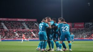 Antony and Isco celebrating with their Real Betis teammates after a goal