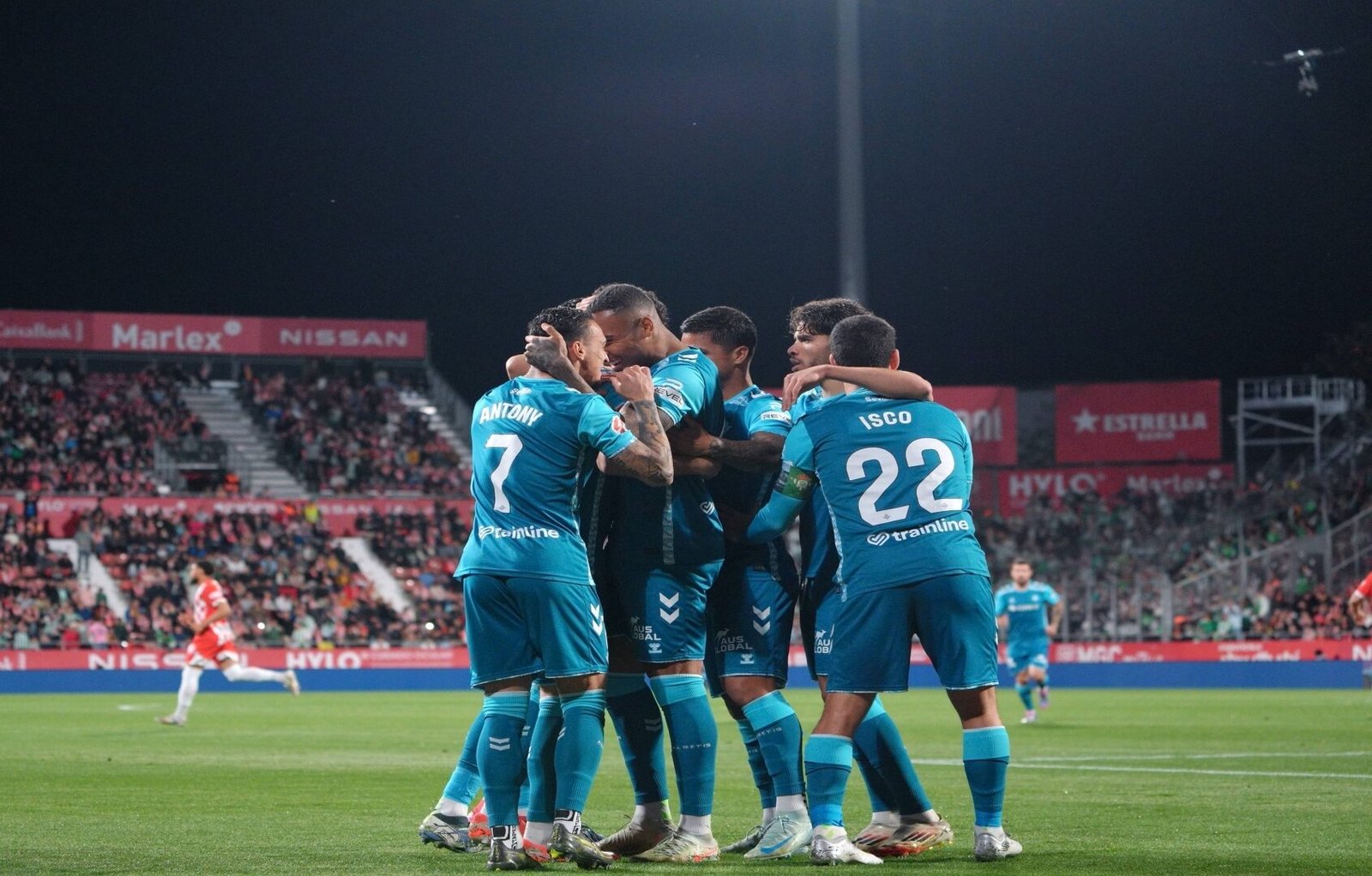 Antony and Isco celebrating with their Real Betis teammates after a goal